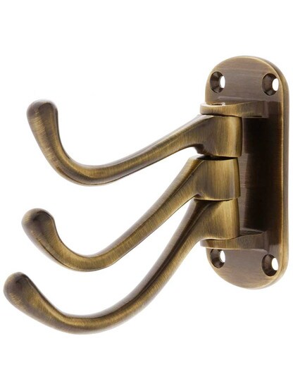 Solid Brass Triple Swivel Hook in Antique Brass.